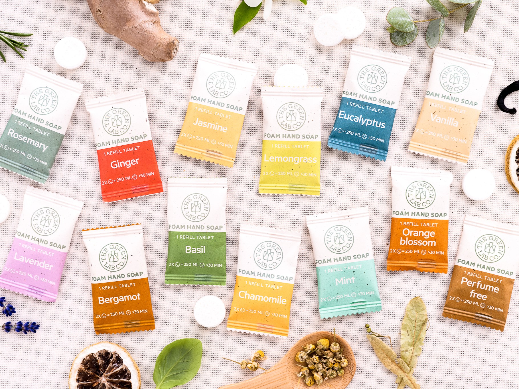 Assorted The Green Lab Co foam hand soap refill tablets in various scents on a light background.